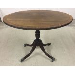 An oval reproduction coffee table 69cm long.