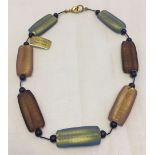 A Murano glass necklace with retangular beads. Original label still attached.