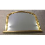 A large gilt framed mantle mirror. Approx 99 x 74cm.