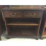 A mahogany bookcase with 2 drawers, approx 76 x 73cm.