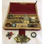 Red velour jewellery case containing a good collection of vintage brooches.