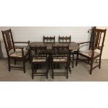 Dark oak refectory table with 4 chairs and 2 carvers, floral upholstered seats.