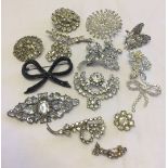 A quantity of diamante stone set costume brooches.