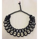 A dramatic crystal & velvet collar style necklace.