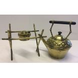 A brass spirit kettle on stand with ebony handle.