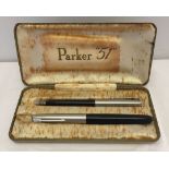 A vintage boxed Parker '51' fountain pen and mechanical pencil in black and silver.
