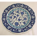 A blue & white hand painted ceramic turkish plate.