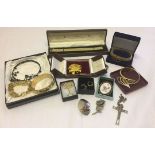 A quantity of costume jewellery to include goldtone bracelets and brooches.