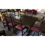 A large oak refectory table with 10 chairs (8 + 2 carvers) size 212cm x 88cm.