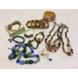 A quantity of costume jewellery to include natural stone & agate bracelets and necklaces.