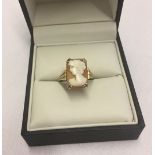 A 9ct gold dress ring set with a square cameo. Size O, weight approx 4.2g