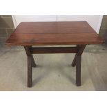 A pine table with plank top measuring 2ft x 3ft.