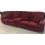 2 modern two seater sofas in deep red chenile type fabric with matching cushions.