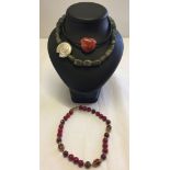 2 necklaces with natural stone beads together with a red & purple glass bead necklace with Tiffany