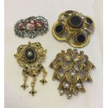 4 pretty costume jewellery brooches to include Hollywood & Spinx.