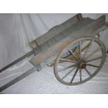 An unusual old painted wood two-wheel bu