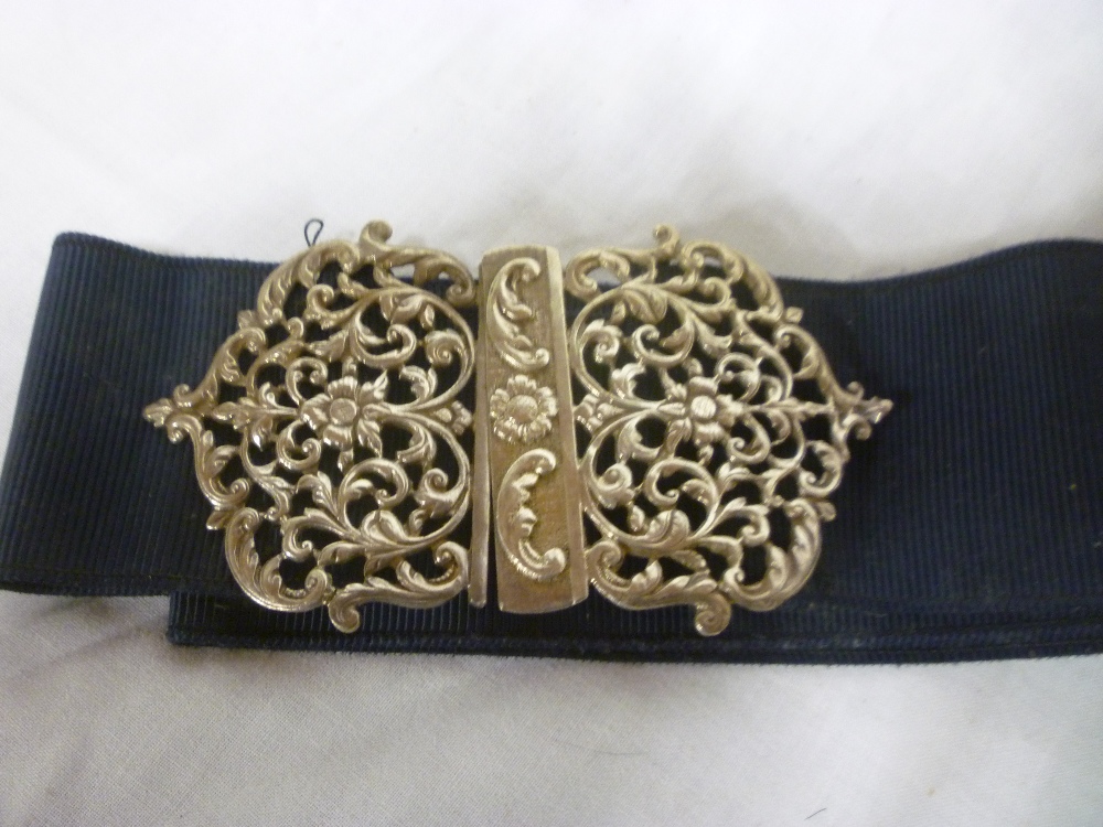 A satin nurses belt with silver two-part