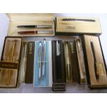 A selection of boxed pens and pencils in