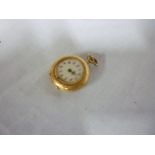 A ladies 14ct gold pocket watch with cir