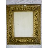 An ornate rectangular gilt picture frame