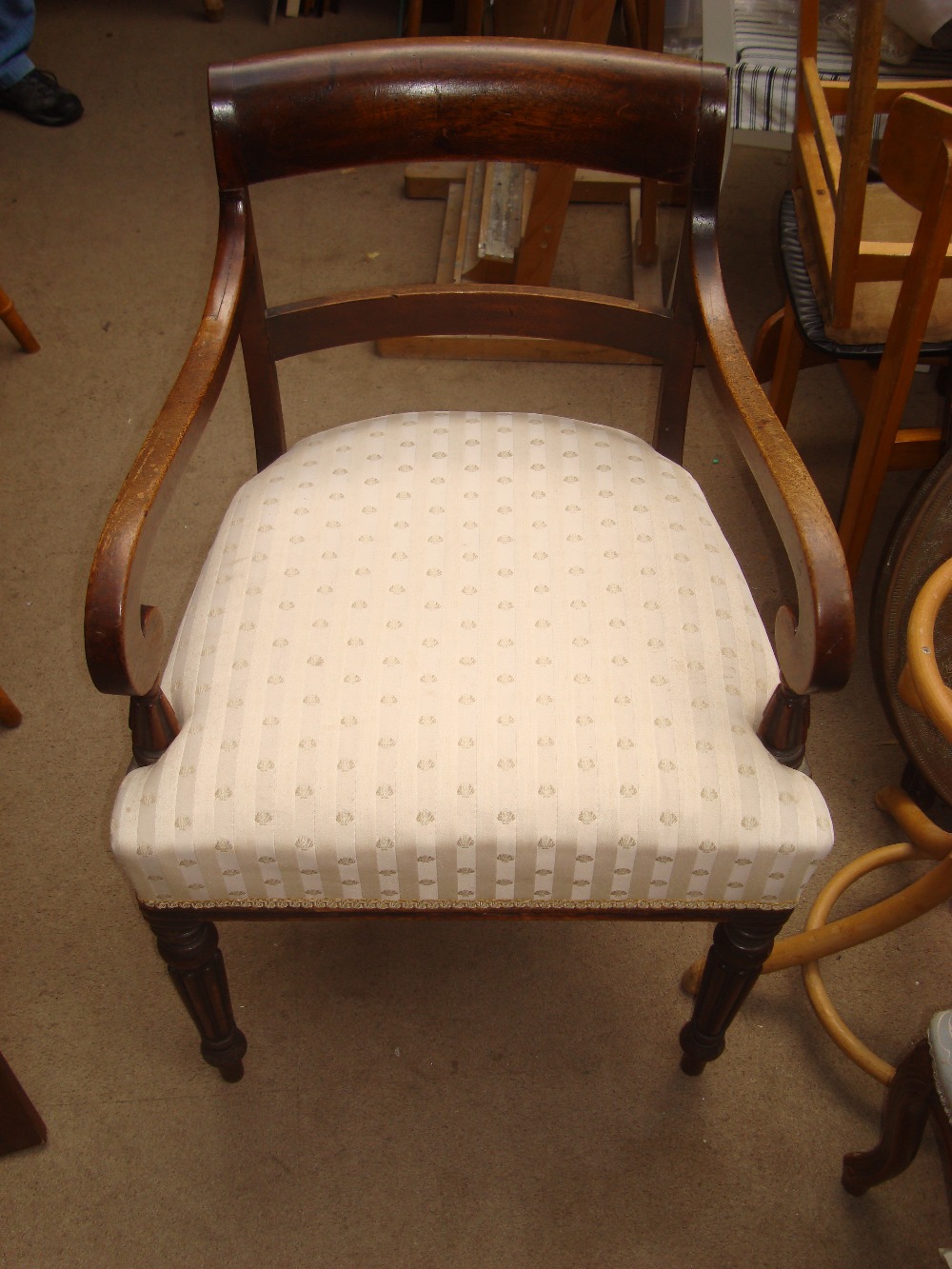 An early 19th Century mahogany elbow chair.