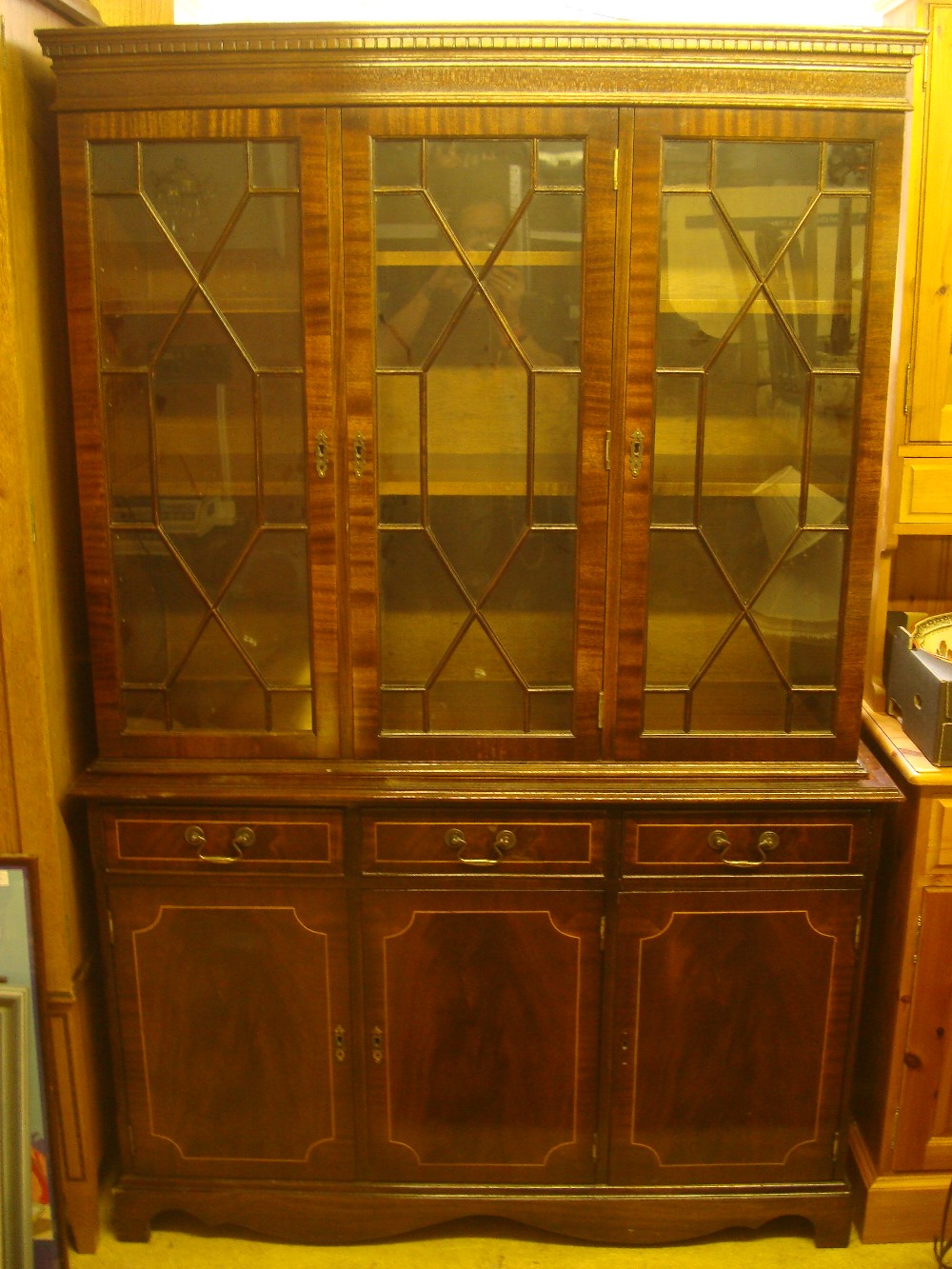 A reproduction mahogany astragal glazed bookcase.