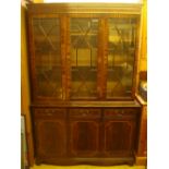A reproduction mahogany astragal glazed bookcase.