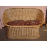 A 1970's Habitat willow basket wicker two seater sofa. 122 x 65 x 77cm high.