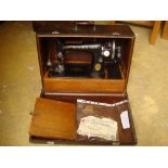 A cased Singer sewing machine with original invoice.