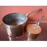 A 19th Century copper pan and one smaller.