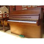 An Elysian mahogany cased upright piano, three pedal, 144cm. M28912 on frame. 1855066.