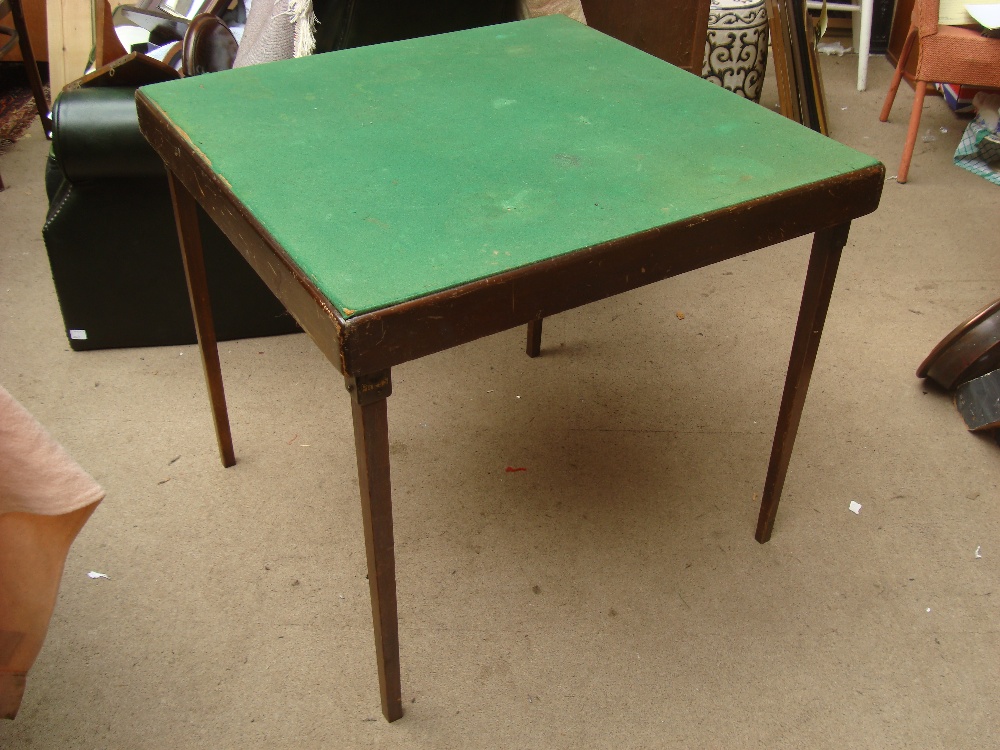 A baize topped folding card table.