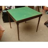 A baize topped folding card table.