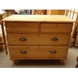 A small Continental pine chest of drawers, with two projecting short drawers over two long.