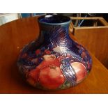 A Moorcroft squat vase, Finches Blue by Sally Tuffin, impressed marks.