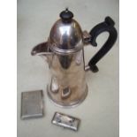 A silver cigarette case together with RMS Aurania manicure kit and a coffee pot.