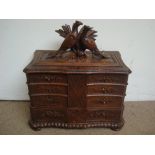 A large Black Forest table top cabinet.