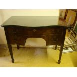 A George III style mahogany serpentine fronted dressing table,