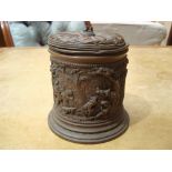 A 19th Century Continental copper relief cast tobacco jar and cover with tamper,