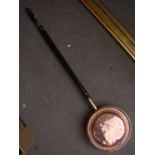 A 19th century copper warming pan with ebonised turned handle