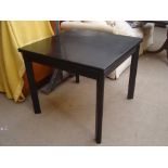 A 1970's Habitat black ash foldover dining table. 90 x 90 x 76cm high (180cm fully extended).