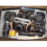 A Minolta 7000 SLR, a Werramatic camera etc.