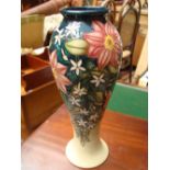 A Moorcroft tubelined baluster vase, "Travellers Joy".