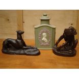 A limited edition Wedgwood Jasperware cannister and two resin dogs.