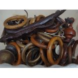 A box of mainly 19th Century curtain pole rings, finials etc.