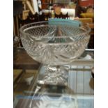 An early 20th Century cut glass bowl on square foot.