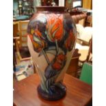 A large Moorcroft baluster vase, Red Tulip pattern by Sally Tuffin.