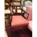 A George III Sheraton type mahogany elbow chair,