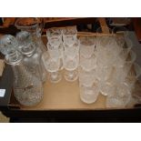 Two cut glass decanters, a jug and twenty glasses - some with acid etched decoration.