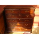 A George III oak chest of drawers,